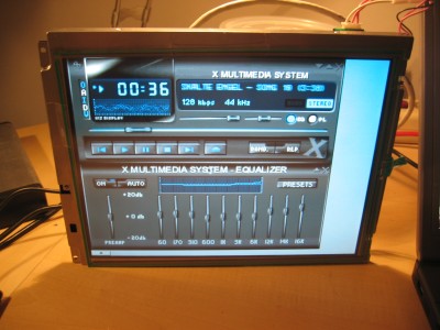 WikiImage X-Session mit KDE; OFSP6 als mp3-Player mit XMMS; Ein anderer Rechner spielt die Musik ab